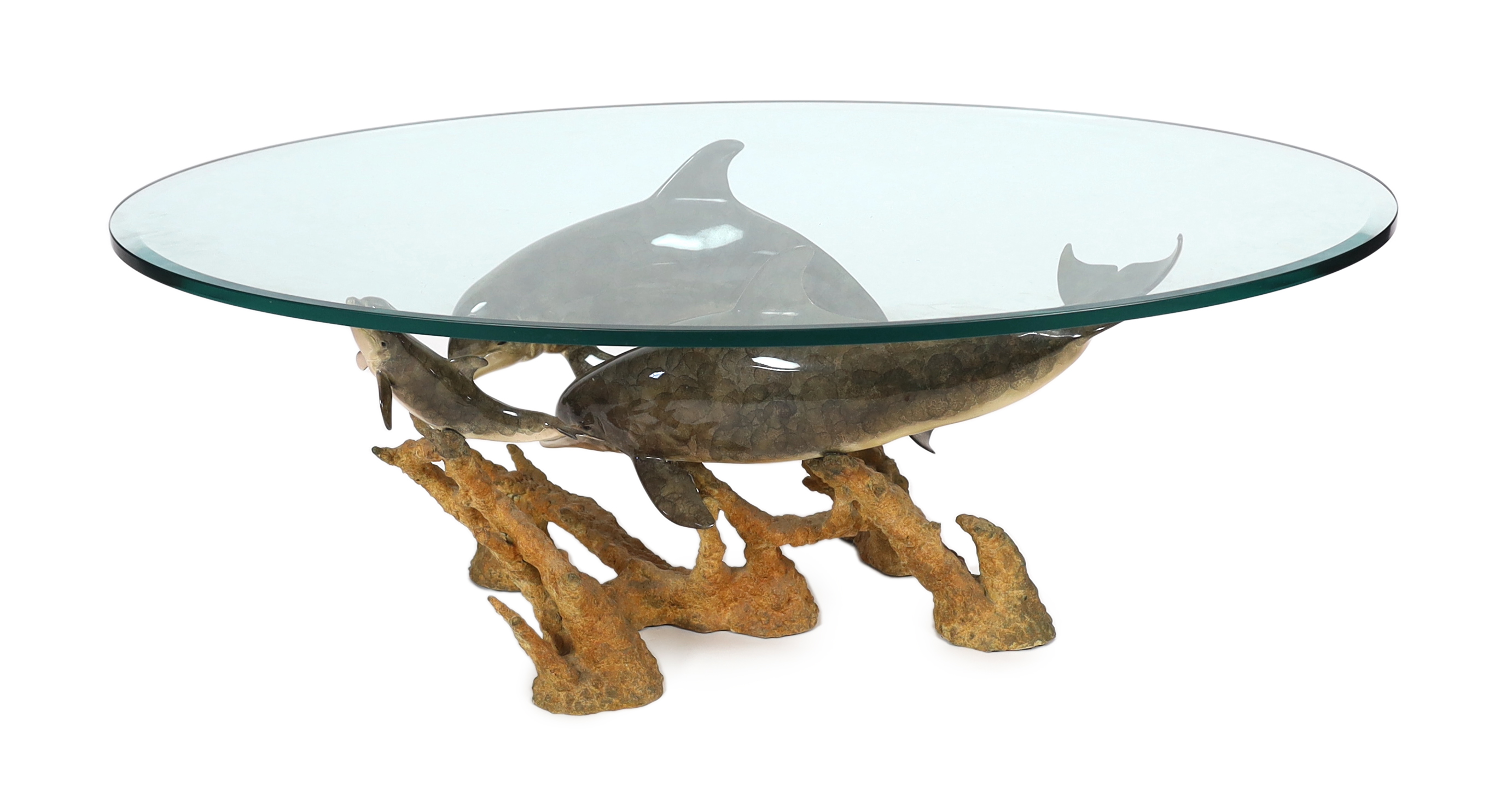 Robert Wyland (American, b.1956), a patinated bronze group 'Dolphin Reef', 81cm long, 53cm deep, 45.5cm high, comes with a plate glass oval top, 130 x 81cm